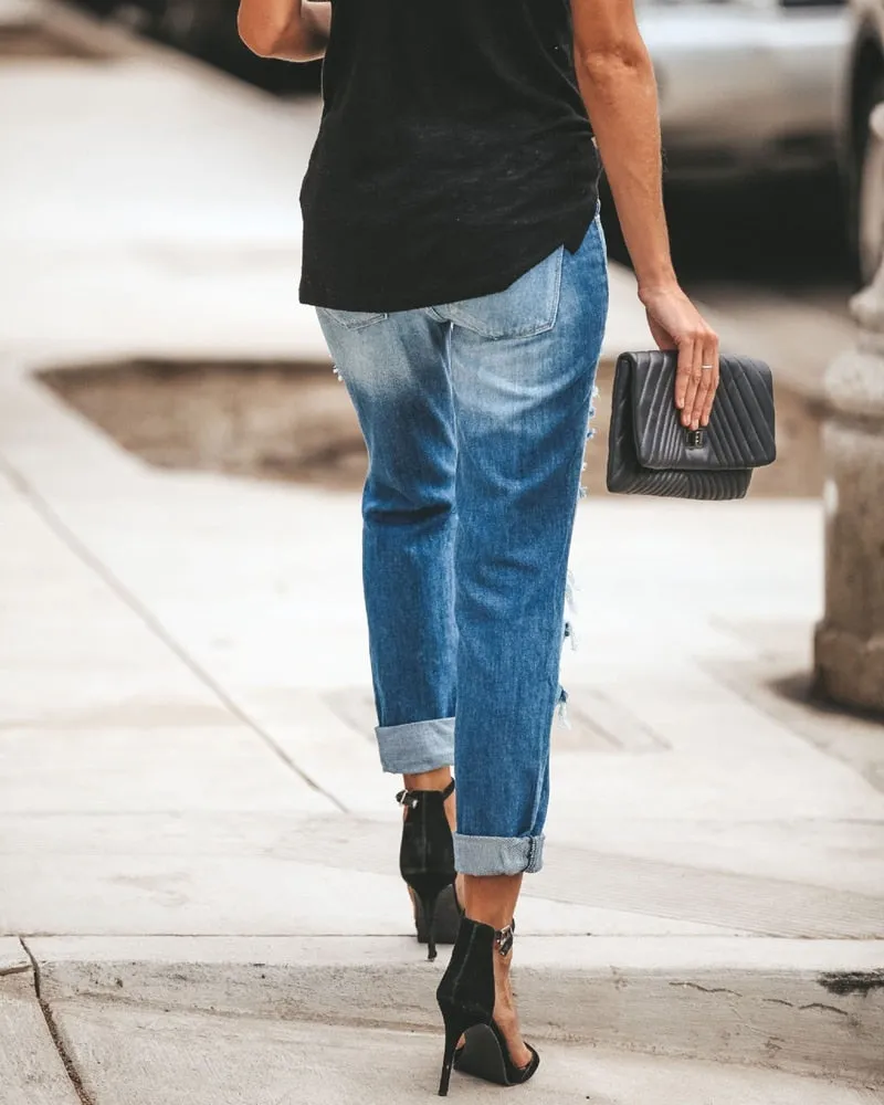 Women Fashion Mid Waist Ripped Jeans.